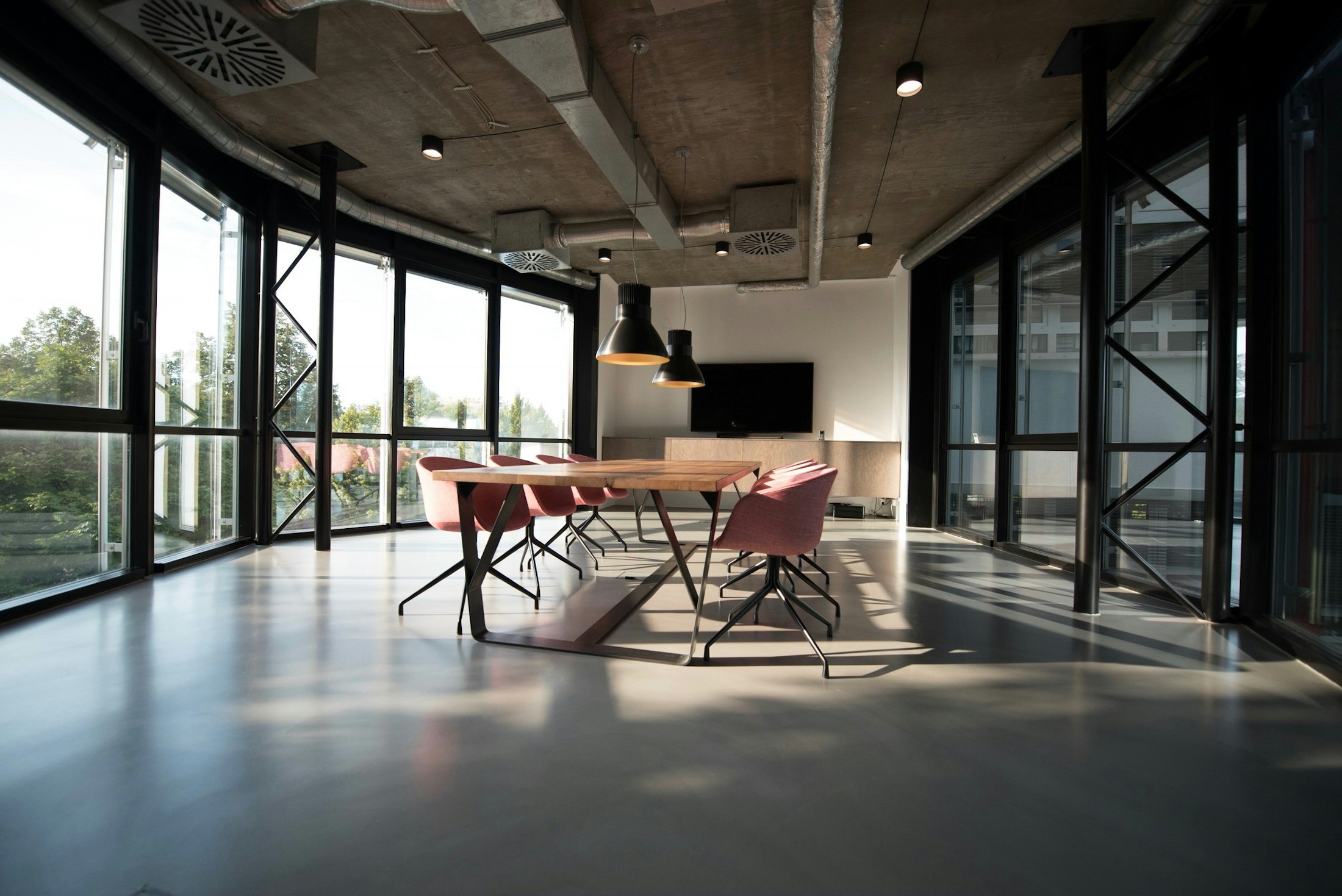 Light-filled commercial workplace with exposed ceilings and carefully finished interiors