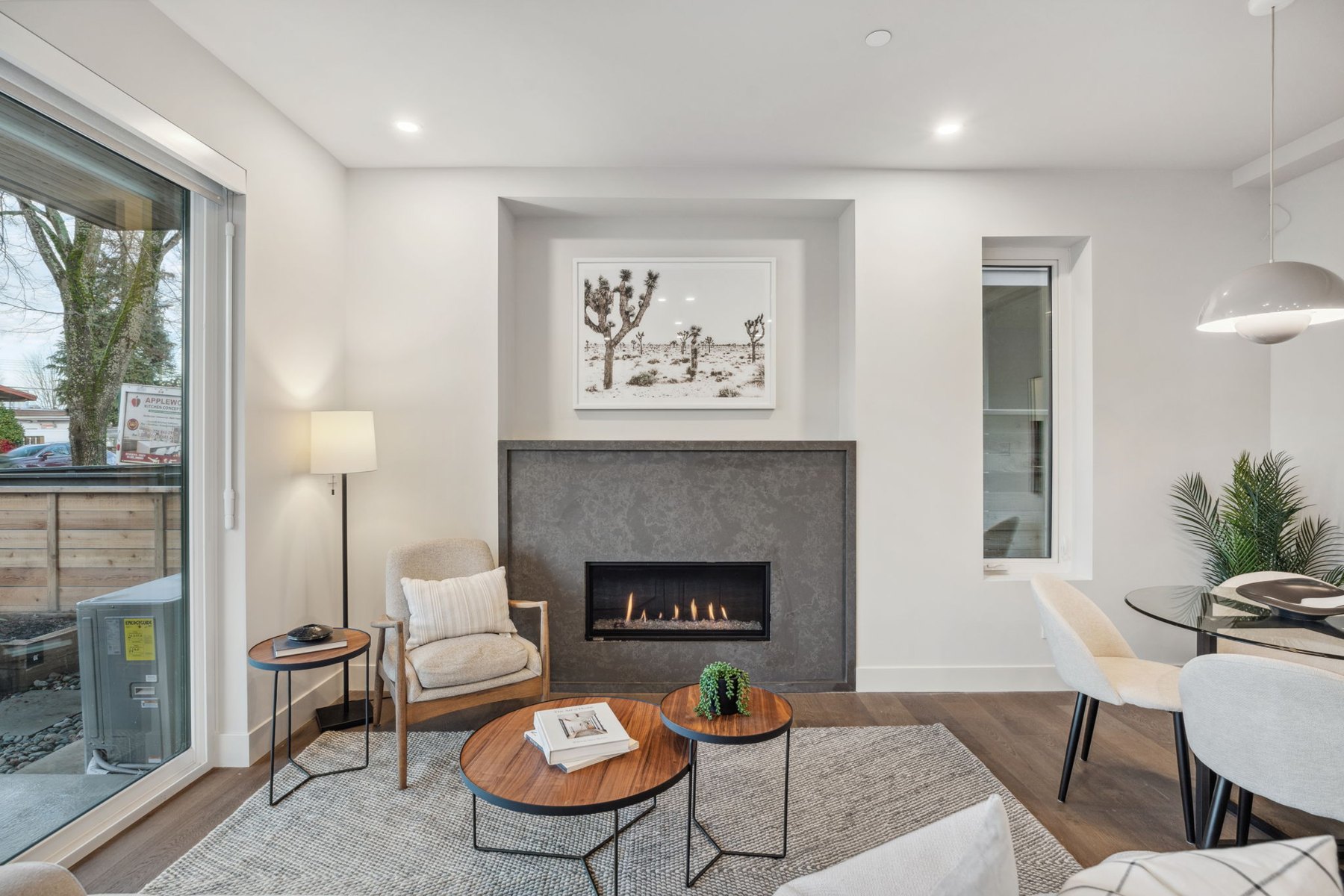 Finished living room at Fraser Residences, with oak flooring and a contemporary fireplace